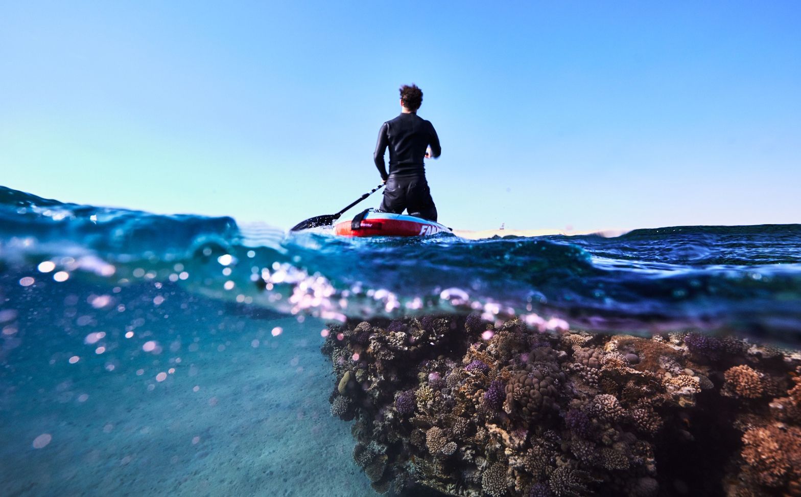 NEOM, SAUDI ARABIA – DECEMBER 6: Jeremy Bishop explores underwater and on a paddleboard at Haddah Beach & Gulf of Aqaba Coastline on December 6, 2022, in NEOM, Saudi Arabia.